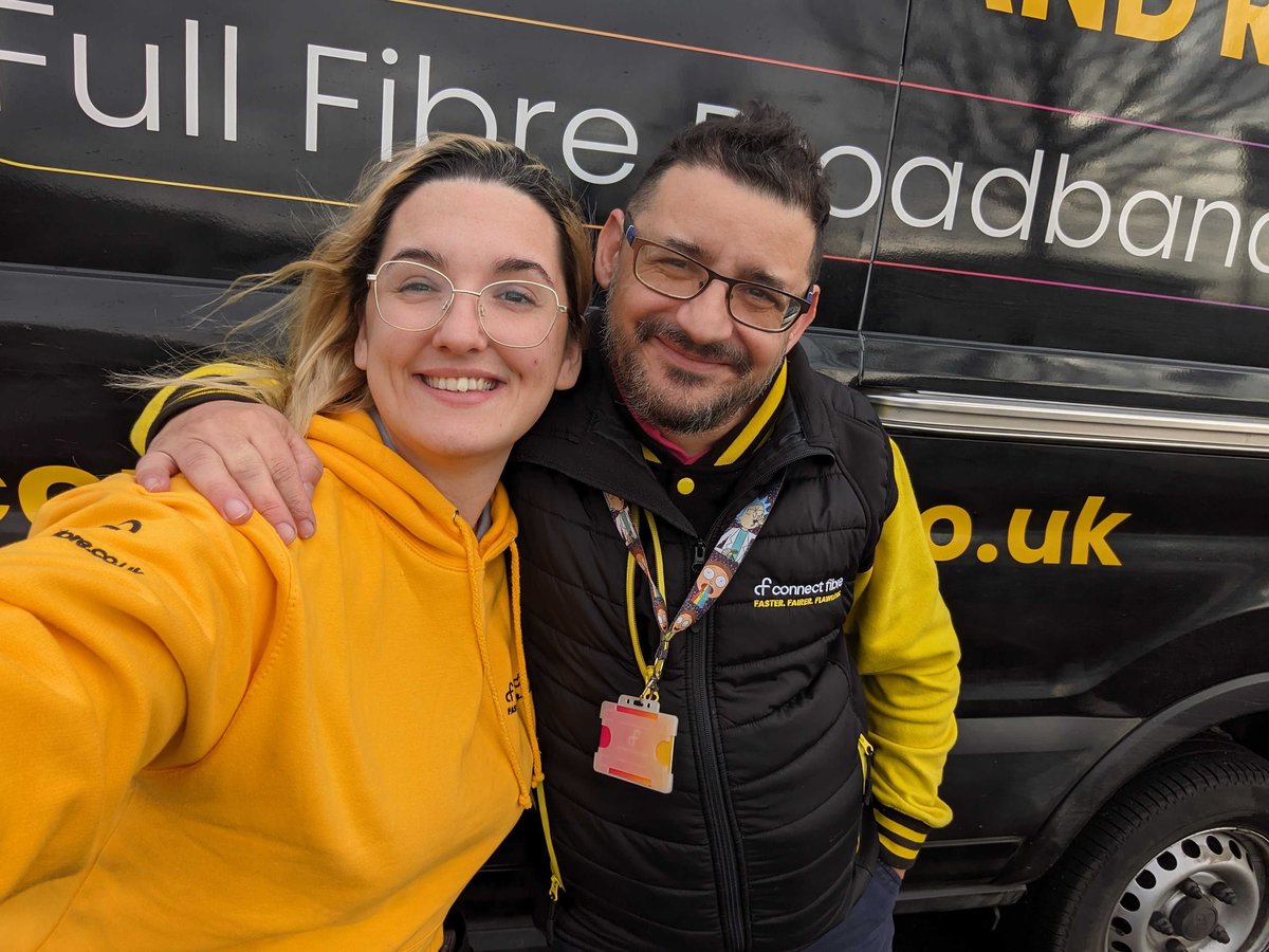 Two Connect Fibre team members stood together in front of a van