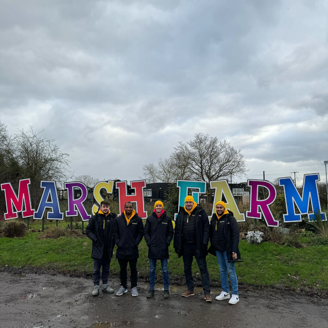 5 Connect Fibre team members stood in front of a sign saying Marsh Farm