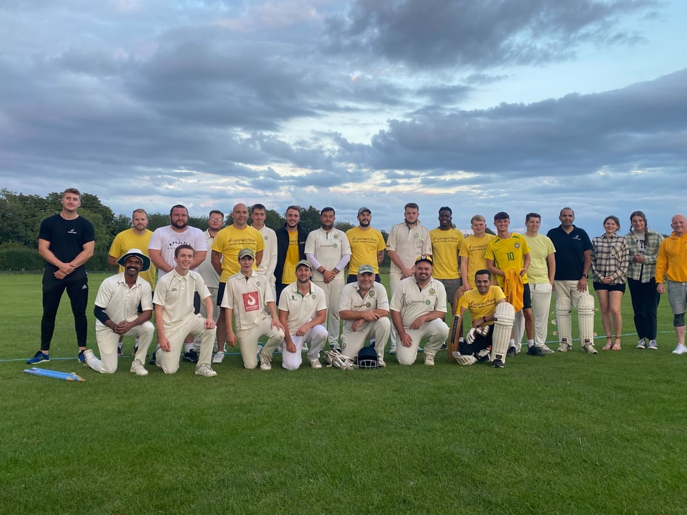 Sutton Cricket Club and Connect Fibre team posing together on a field