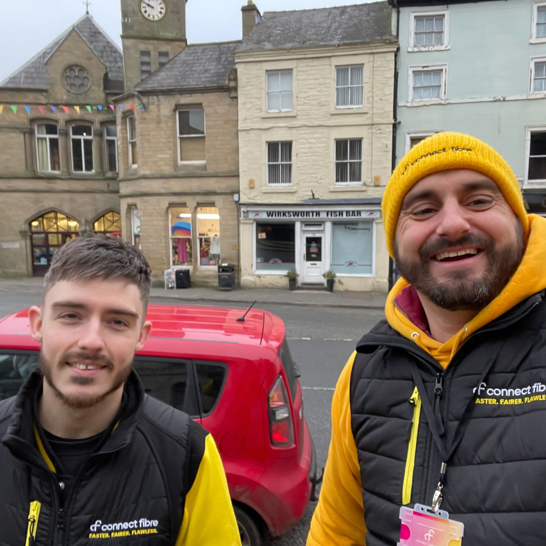 Two Connect Fibre fibre experts stood in a Workswirth street, smiling