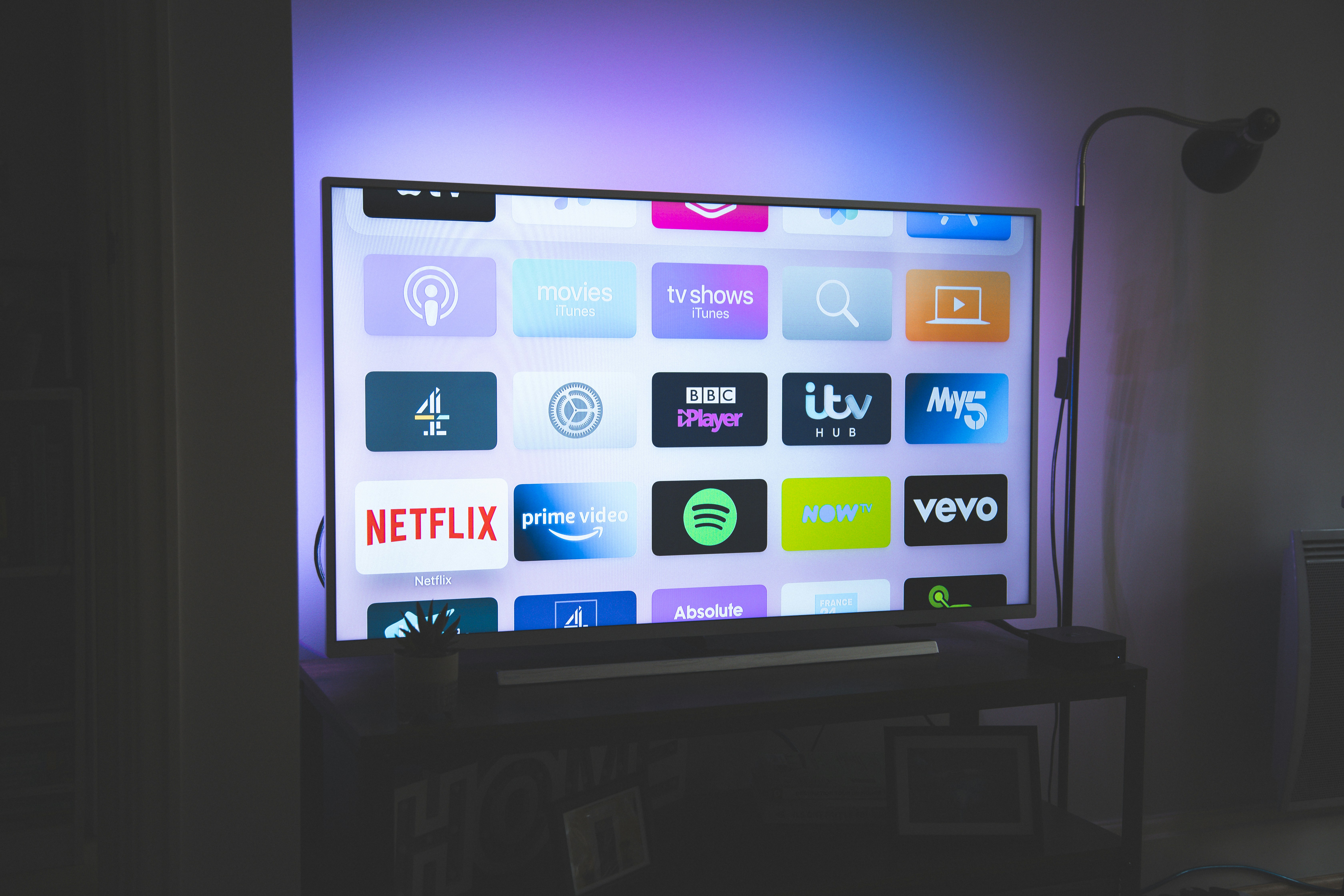 Various streaming platforms shown on a tv screen